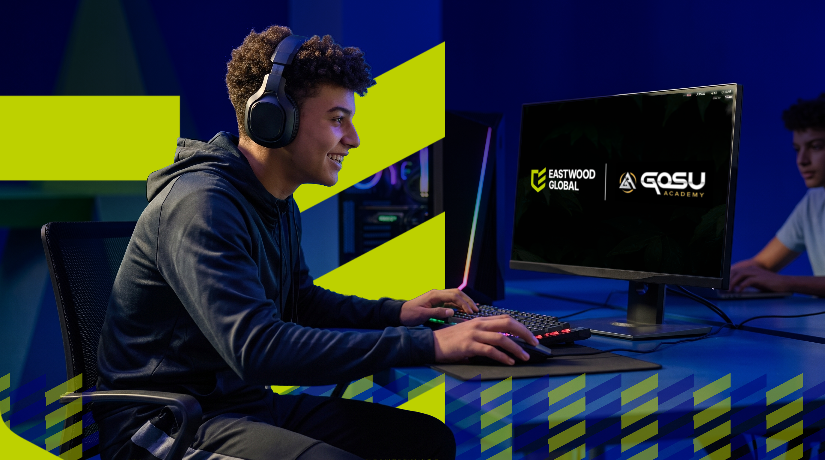 An Eastwood Global student competing at a gaming setup, with the Eastwood Global and GOSU Academy lockup on screen